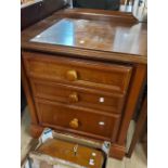 A pair of 60cm modern stained wood bedside chests of three graduated drawers