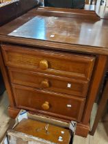 A pair of 60cm modern stained wood bedside chests of three graduated drawers