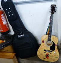 A Falcon acoustic guitar with soft carry case