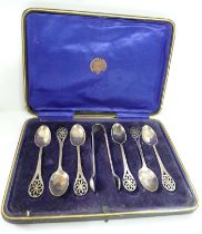 A cased set of six silver teaspoons and tongs, all with pierced decoration