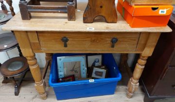 A 92cm old pine side table with frieze drawer, set on flanking turned supports - edge moulding loss