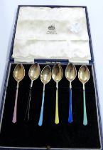 A set of six silver and coloured enamel coffee spoons - Birmingham 1961, one 1959 - in associated