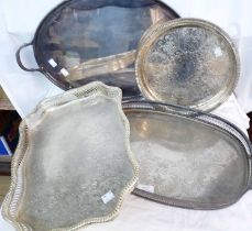 Five assorted silver plated tea and serving trays including three galleried examples