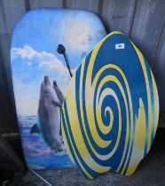 A small boogie board and a skim board