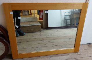 A modern golden oak framed oblong wall mirror