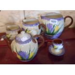 A set of three Longpark pottery Torquay graduated jugs decorated in the Crocus pattern - sold with a
