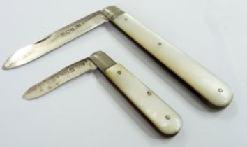 Two silver folding fruit knives, both with mother-of-pearl clad handles
