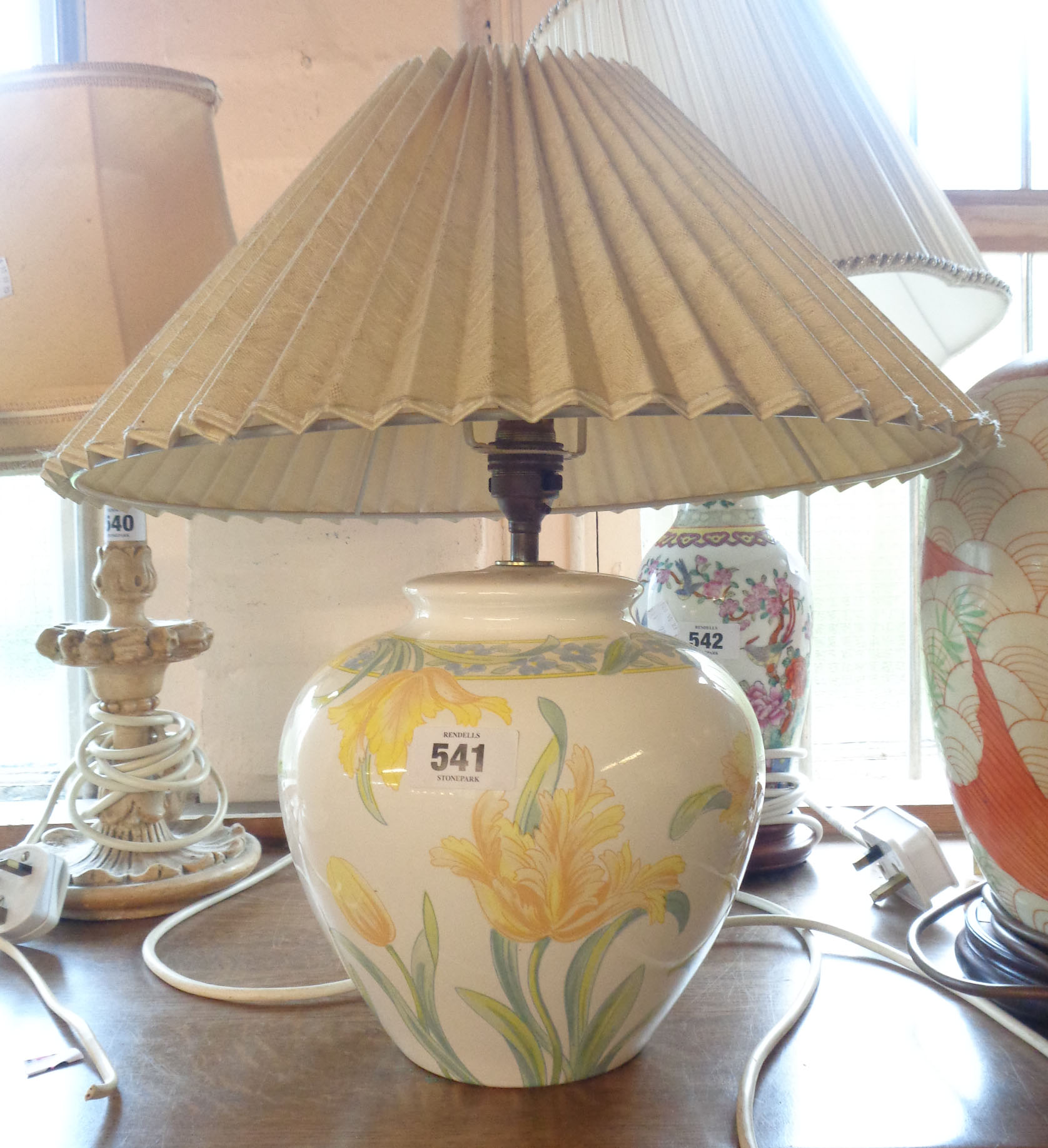 A ceramic table lamp of vase form, with transfer-printed floral decoration - sold with shade