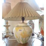 A ceramic table lamp of vase form, with transfer-printed floral decoration - sold with shade