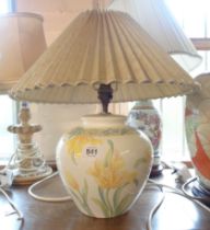 A ceramic table lamp of vase form, with transfer-printed floral decoration - sold with shade
