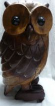 A large carved wood owl figurine