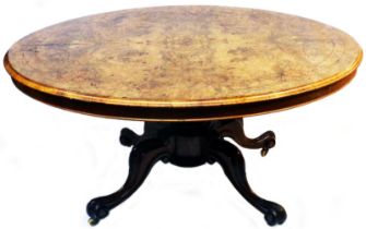 A 1.3m Victorian inlaid figured walnut oval loo table with quarter veneered top, set on massive