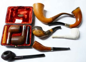 A bag containing a quantity of old pipes including silver mounted, cherry wood, etc. - sold with a