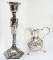 A late Victorian silver baluster cream jug, set on triple paw pattern feet - London 1891 - sold with