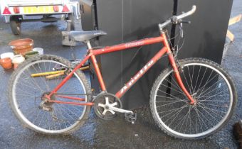 An Apollo Terra ladies' bicycle with orange finish