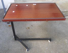 A modern bed table with metal base