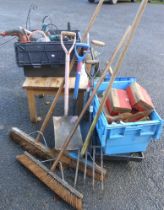 A large quantity of assorted garden and other tools including a crate of fixings, petrol cans,