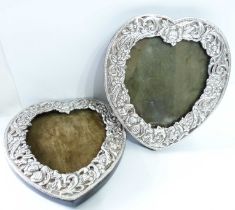 A pair of 15cm high marked 'sterling'/GL 915 heart shaped photograph frames with embossed floral and