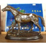 A modern bronze figure of a horse