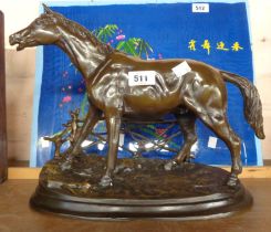 A modern bronze figure of a horse