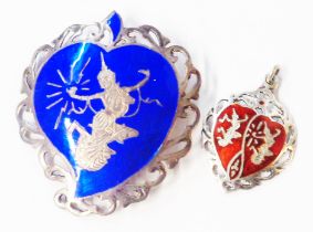 A 'Siam sterling' blue enamelled brooch with deity decoration - sold with smaller red enamelled