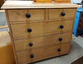 A 1.10m Victorian waxed pine chest of two short and three long graduated drawers, set on turned