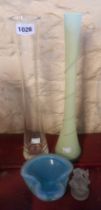 A tall green glass vase with frosted finish and trail decoration, a tall clear glass vase and a