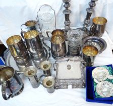 A box containing a quantity of silver plated items including tray, candlesticks, tankards, etc.