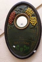 A decorative French advertising mirror plaque with small circular plate, flanking applied and