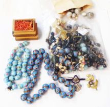 A bag containing Italian decorative glass bead necklaces, banded agate and other loose beads, also