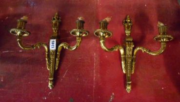 A pair of vintage cast brass two branch wall sconce lights
