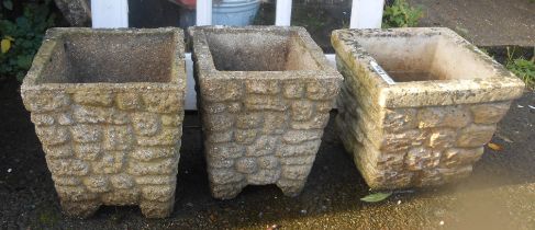 A pair of small concrete planters of square tapered form - sold with another similar