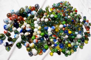 Two tubs and a box containing a quantity of vintage and later glass marbles