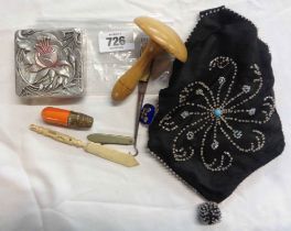 A vintage beadwork bag containing a quantity of collectable items including silver and enamel