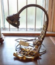 An Art Nouveau style cast brass table/wall lamp