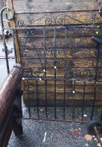 A wrought iron garden gate with pierced scroll decoration - 1.07m X 1.26m