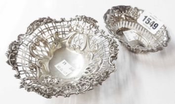 A silver bon bon dish with pierced and embossed decoration, set on ornate cast base - London