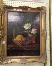 A gilt framed late Victorian oil on canvas still life with fruit in a glass bowl, flowers and