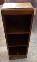 A vintage stained oak narrow three shelf open bookcase