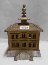 A Victorian cast iron house pattern money box