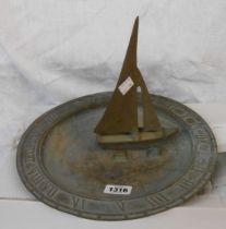 A vintage cast brass sundial with yacht pattern nomen and Tempus Fugit to rim