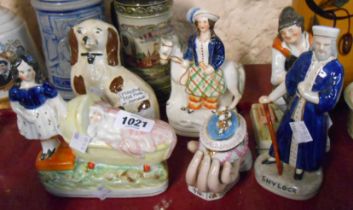 A small quantity of Staffordshire and other figurines - sold with a Conte & Boehme German