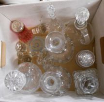 A box containing a quantity of assorted glassware including decanters, stoppers, etc.