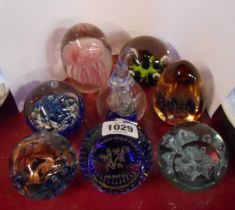 Eight glass paperweights including Caithness, etc.