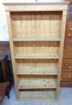 A 95cm modern pine five shelf open bookcase with moulded top, set on plinth base - 1.88m high