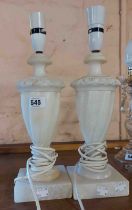 A pair of alabaster table lamps of wrythen form