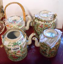 Four Chinese porcelain Canton kettles of various size with famille rose decoration - one lid missing