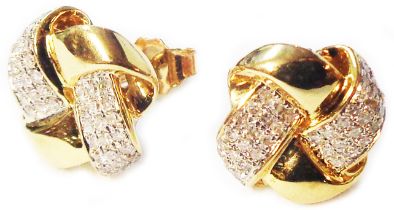 A pair of 585 (14ct.) gold ribbon twist stud earrings, set with flanking multiple rows of small