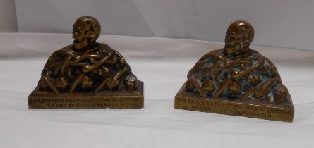 Two old cast brass 'Prehistoric Man of Cheddar' desk paperweights