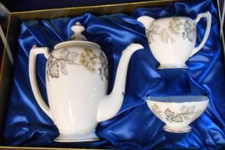 A vintage boxed Coalport bone china coffee set comprising coffee pot, cream and sugar, and six